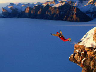 Man jumping cliff water snow 2 - extreme illustration free wallpaper
