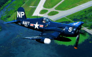 Navy plane green field river - f 8 aperture free wallpaper