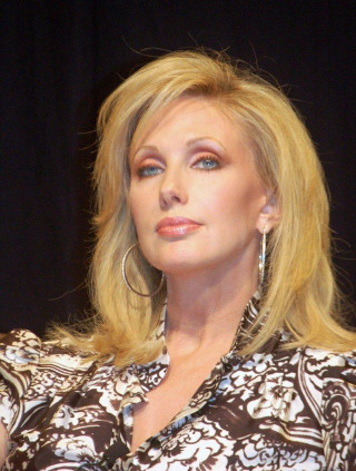 Blonde haired woman serious look - carol sutton free wallpaper for mobile