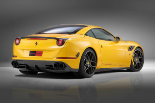 Yellow sports car studio photo - a gray background behind free wallpaper