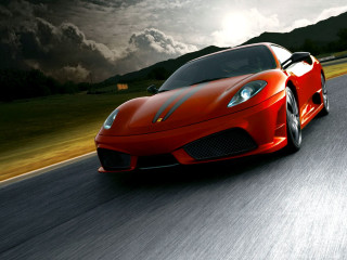 Red sports car driving cloudy - motion blur free wallpaper