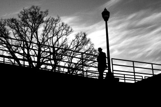 Person walking bridge streetlight bare - film noir free wallpaper