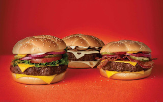 Three cheesebacon lettuce hamburgers red - a red surface free wallpaper