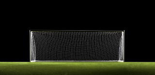 Soccer goal green field black - a white line free wallpaper
