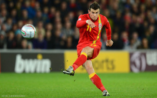 Man kicking soccer ball field 10 - the stand free wallpaper