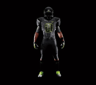 Football player black uniform green - a football player free wallpaper for tablet