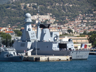 Battleship city hillside town background - a large battleship free wallpaper