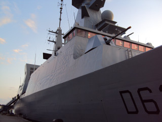 Large boat docked dock building - a building in the foreground free wallpaper