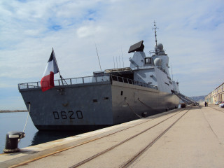 Large boat docked flag mast - a large boat free wallpaper