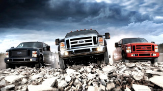 Trucks parked rocky road cloudy - brian fies free wallpaper