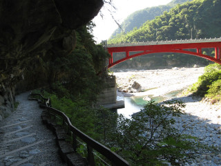 Red bridge river green hillside - a red bridge free wallpaper