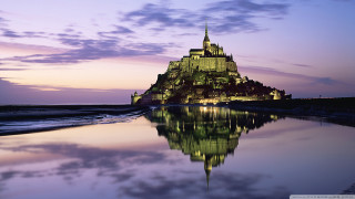 Castle lit night beach reflection - a reflection free wallpaper