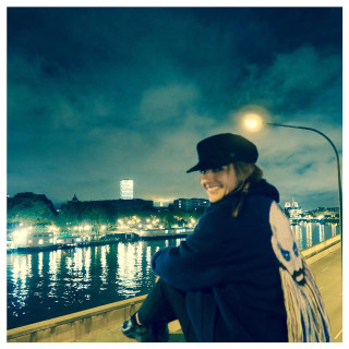 Woman sitting ledge water night - an impressionist painting free wallpaper for tablet