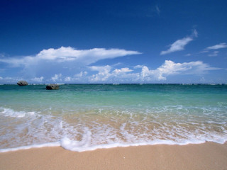 Sandy beach rock blue sky - a sandy beach free wallpaper