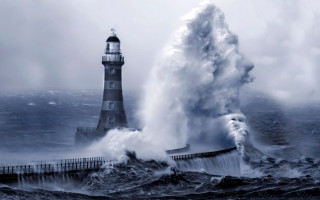 Lighthouse large wave crashing ocean 2 - a lighthouse in the background free wallpaper