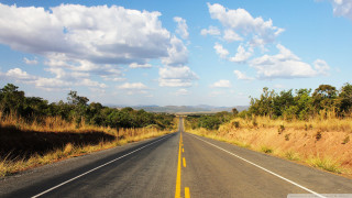 Long road yellow line field 3 - a long road free wallpaper