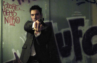 Man pointing gun camera graffiti - andrew bell free wallpaper