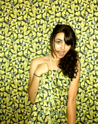 Woman standing wall green yellow - free portrait wallpaper