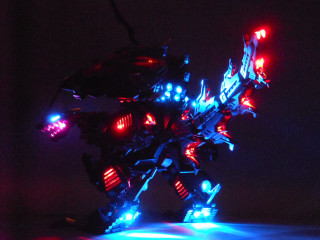 Toy robot lights dark background - free light wallpaper for desktop