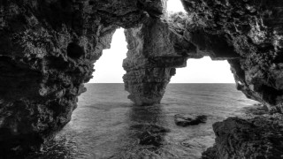 Black white rock formation ocean - exekia free wallpaper