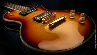 Guitar brown body gold neck - a guitar free wallpaper