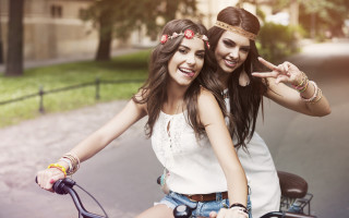 Girls bike peace sign smiling - a peace sign free wallpaper