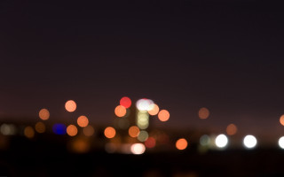 Blurry city night lights background - bokeh free wallpaper