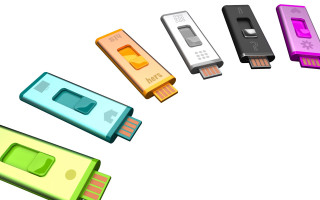 Colored usb devices white surface - product photo free wallpaper for desktop