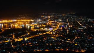 City night lights river below - zenith view free wallpaper