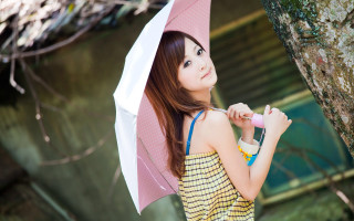 Woman holding umbrella next to - umbrella free wallpaper