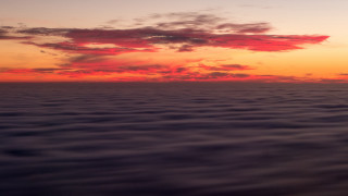 Sunset water clouds plane distance - volumetric fog free wallpaper