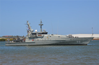 Large gray boat floating shoreline - a shore line free wallpaper