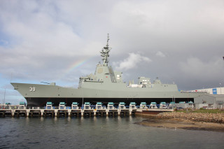 Military ship docked pier rainbow - anson maddock free wallpaper
