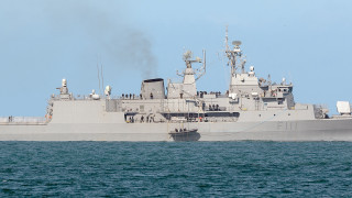 Large gray ship floating water - a jigsaw puzzle free wallpaper