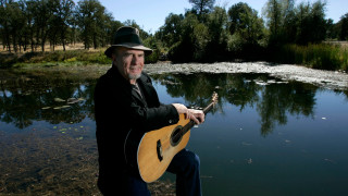 Man guitar water trees pond - earl moran free wallpaper