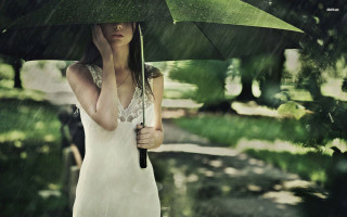 Woman holding umbrella rain park - an umbrella in the rain free wallpaper for desktop