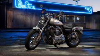 Motorcycle parked building neon sign - a neon sign free wallpaper