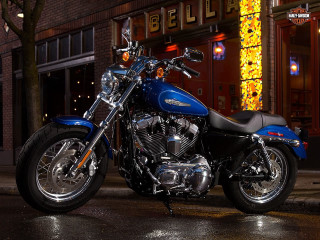 Blue motorcycle parked nighttime lights - a blue motorcycle free wallpaper