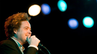 Curly man singing microphone night - chris spollen free wallpaper