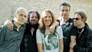 Men group brick wall building - a brick wall behind them free wallpaper