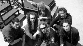 Men sitting sidewalk stairs pointing - a group of men sitting next free wallpaper