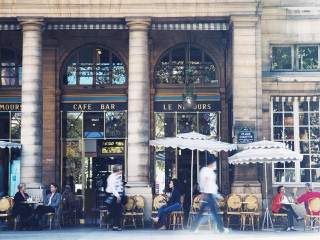 Outdoor dining people umbrellas walking - ambient light free wallpaper