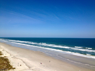 Beach people sky waves boat - free beach wallpaper