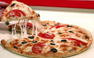 Person taking slice pizza white - a white table free wallpaper