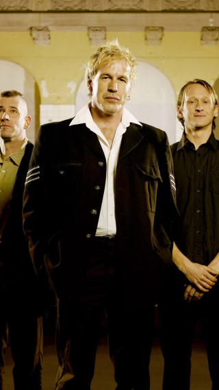 Men standing bauhaus building clock - a still life free wallpaper for mobile