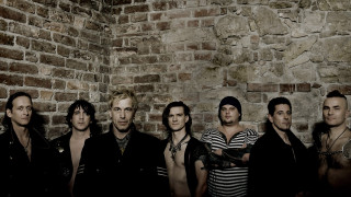 Men group brick wall standing 3 - a brick wall behind them free wallpaper