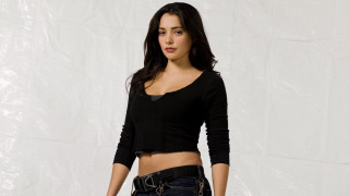 Woman black top jeans white - a white background behind her free wallpaper