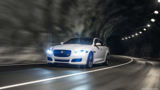 White car driving tunnel night - its headlight free wallpaper