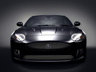 Black sports car studio spotlight - a studio setting free wallpaper for desktop
