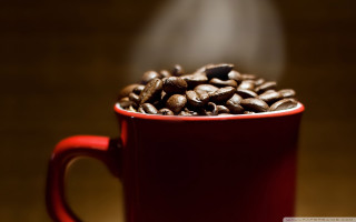 Red cup coffee beans steaming - top of a table next free wallpaper for desktop